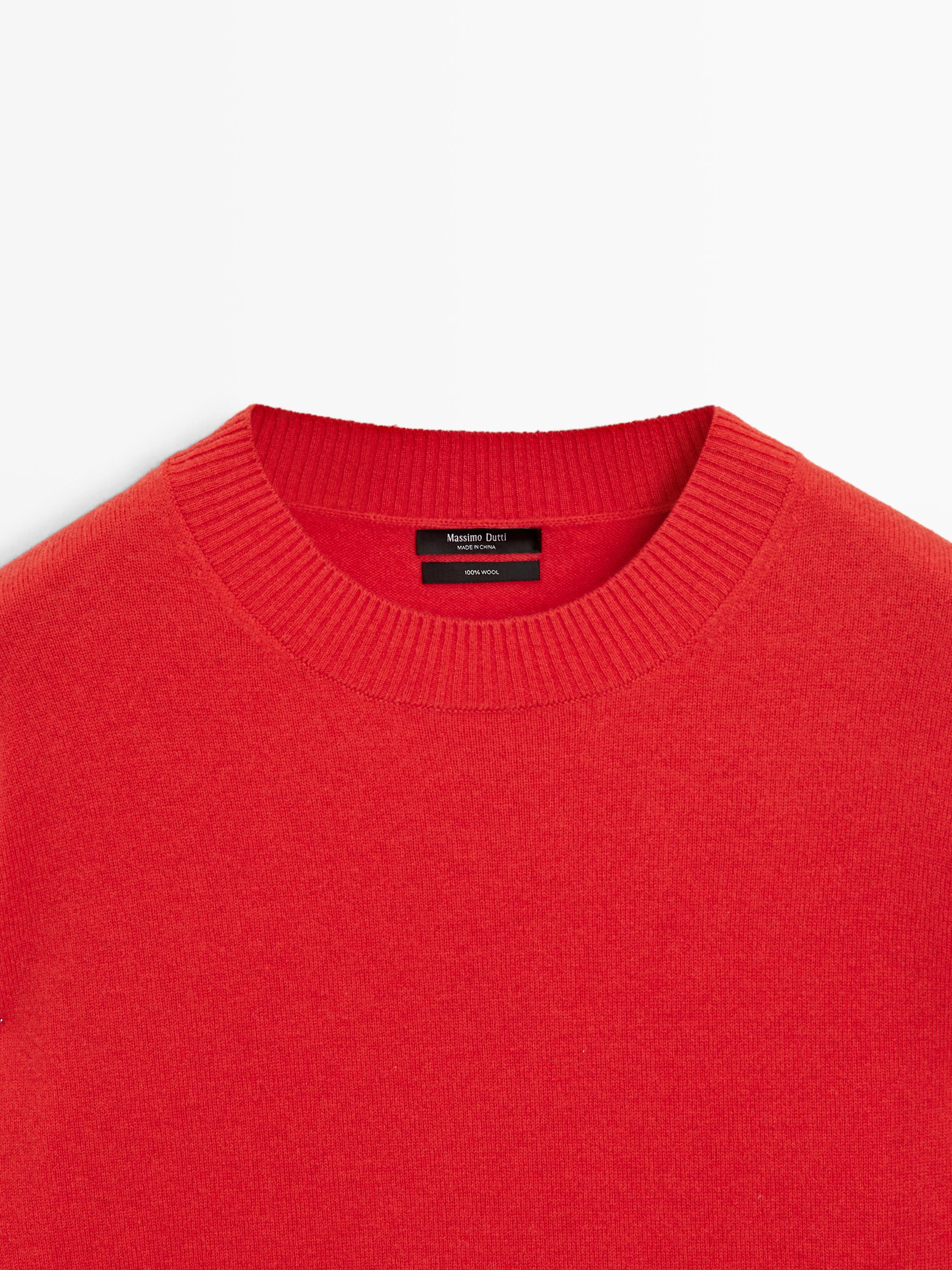 Wool knit sweater with waist detail